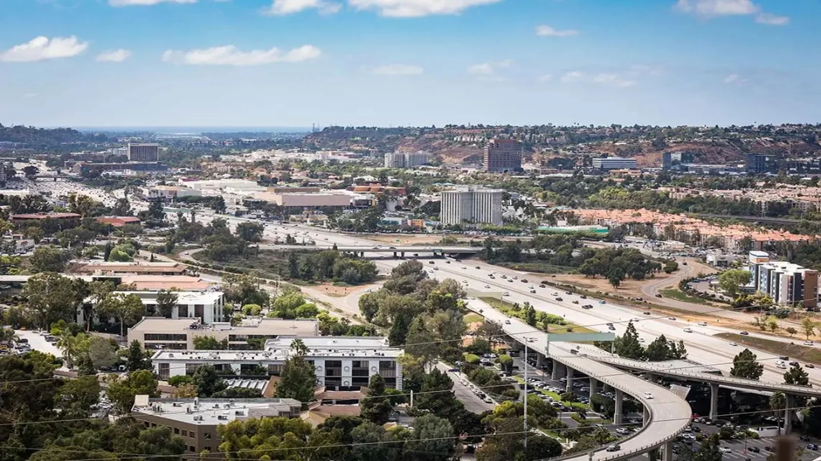 Mission Valley corridor with homes and shopping centers.